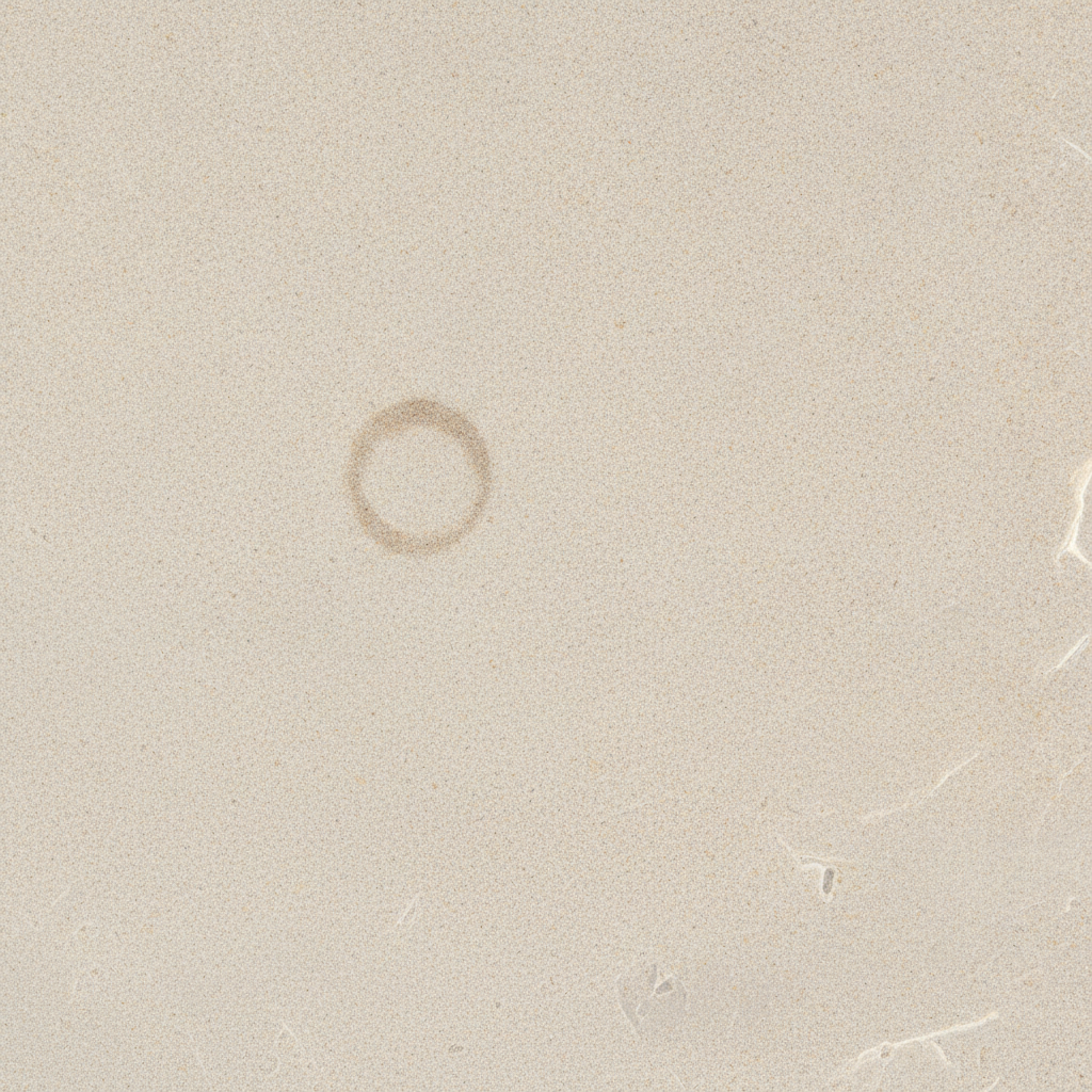 A close-up of a stone café surface, abstract and textural.